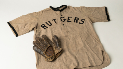 Baseball shirt and glove in University Archives